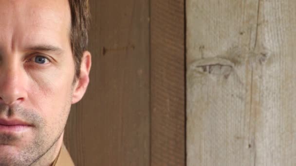 Portrait Man Staring Blinking Wooden Background Copy Space Closeup Face — Vídeo de stock