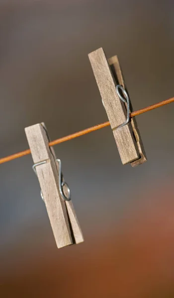 Closeup Two Clothing Pegs Washing Line Blurred Background Wooden Clothespins — kuvapankkivalokuva