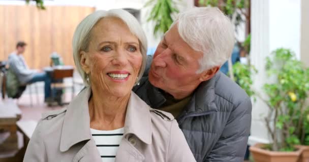 Loving Senior Couple Showing Affection Love Restaurant Retired Husband Kissing — Stockvideo