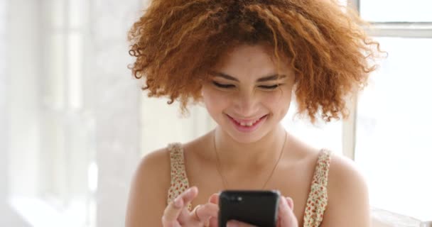 Young Woman Using Phone Bright Room Window Trendy Girl Browsing — Αρχείο Βίντεο