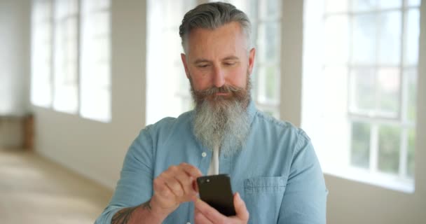 Trendy Man Using His Phone Indoors Modern Mature Male Using — Αρχείο Βίντεο