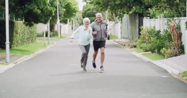 Video Footage Active Senior Couple Running Exercising Together Outdoors Neighborhood — Wideo stockowe
