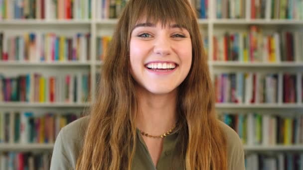 Closeup Portrait Young Female Student Smiling Laughing While Standing Library — Stock Video