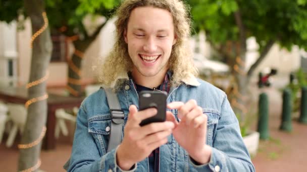 Stylish Male Student Texting His Phone Smiling Laughing Social Media — Stockvideo