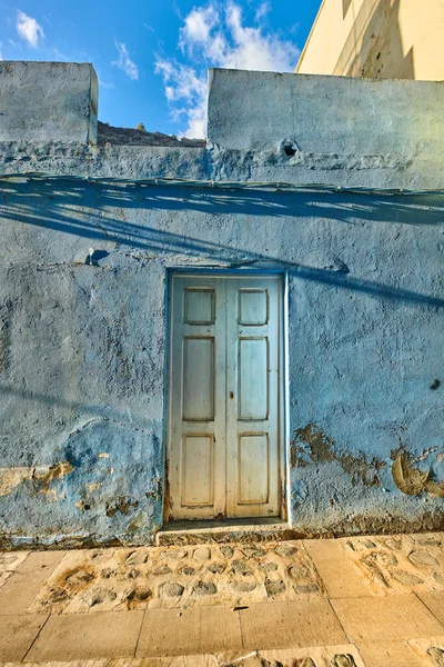Mysterious white door to a house or venue in Santa Cruz de La Palma in Spain. Beautiful cultural and traditional architecture in a small village. Old and ancient exterior of a building structure.