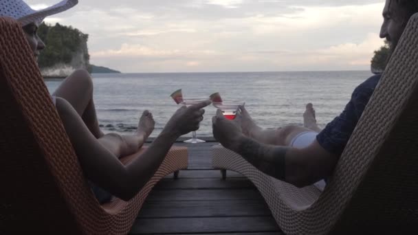 Video Footage Couple Having Drinks While Relaxing Deckchairs Overlooking Ocean — Wideo stockowe