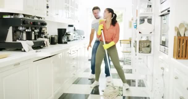 Video Footage Affectionate Young Couple Singing Dancing While Cleaning Kitchen — Stockvideo