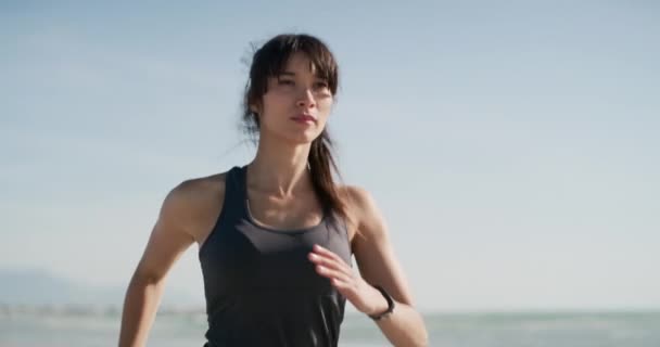 Cropped Video Footage Attractive Young Woman Running Beach Her Own — Vídeos de Stock