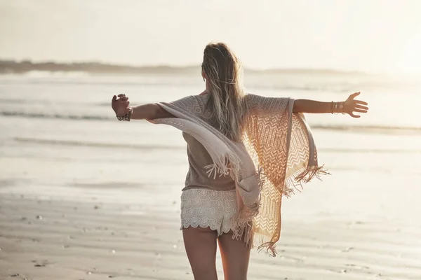 Rearview Shot Young Woman Standing Her Arms Outstretched Beach — Stock fotografie