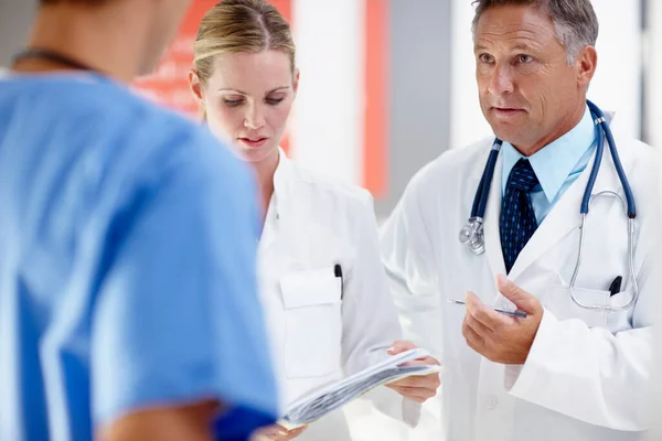 Three Doctors Having Serious Discussion Patient — Fotografia de Stock