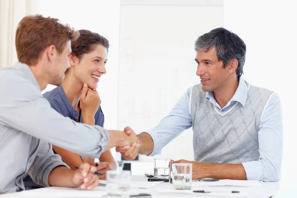 Two Businessmen Shaking Hands While Meeting Female Coworker — 图库照片