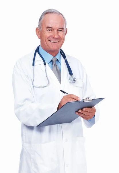 Portrait Smiling Mature Doctor Writing Patients Report White Background — Zdjęcie stockowe