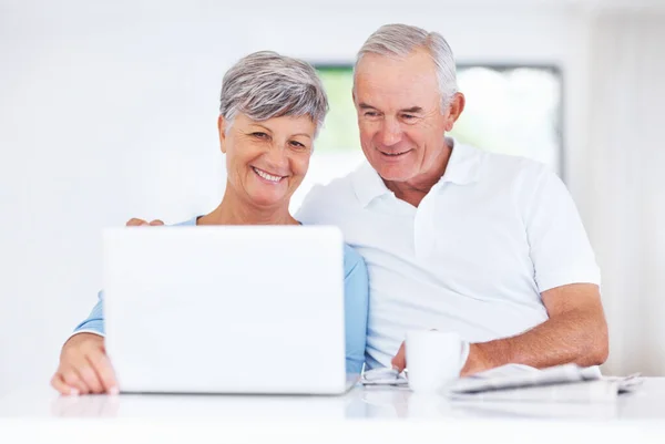 Beautiful Mature Couple Smiling While Using Laptop Home Stock Photo