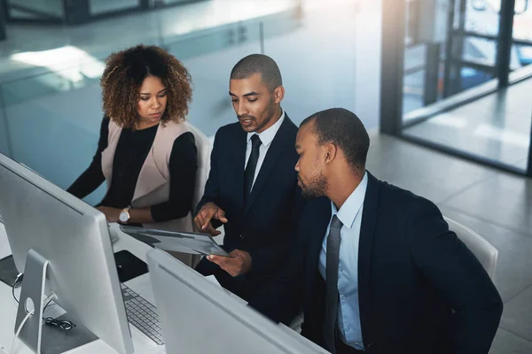 High Angle Shot Three Corporate Businesspeople Looking Some Paperwork Office — Stockfoto