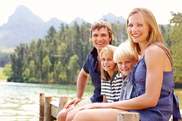 Cute Young Family Sitting Jetty Lake Smiling — Fotografia de Stock