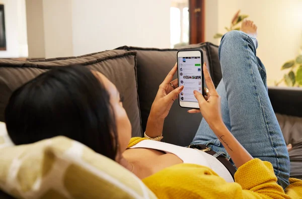 Closeup Woman Using Her Smartphone While Lying Sofa Relaxing Bright — Foto Stock