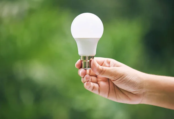 Closeup Hand Holding Light Bulb Nature New Ideas Sustainable Energy — Photo
