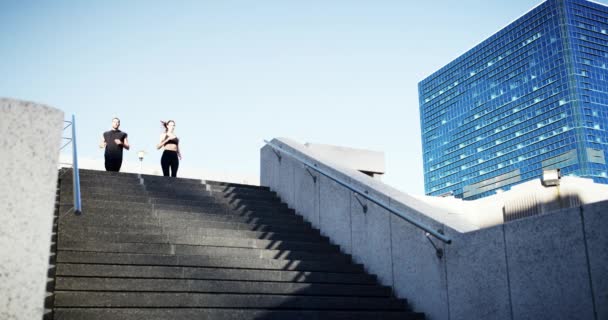 Video Footage Young Couple Running Staircase While Out Jogging City — Wideo stockowe