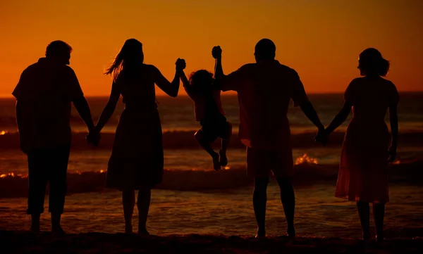Rear View Three Generation Family Silhouetted Beach While Jumping Together — Φωτογραφία Αρχείου