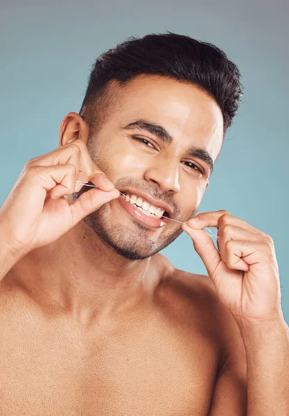 Portrait One Smiling Young Indian Man Flossing His Teeth Blue — Foto de Stock