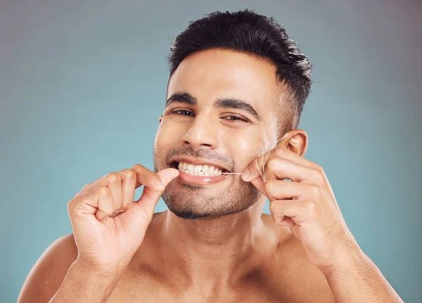 Portrait One Smiling Young Indian Man Flossing His Teeth Blue — 스톡 사진