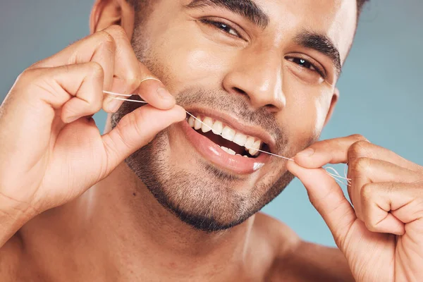 Portrait One Smiling Young Indian Man Flossing His Teeth Blue — Foto de Stock