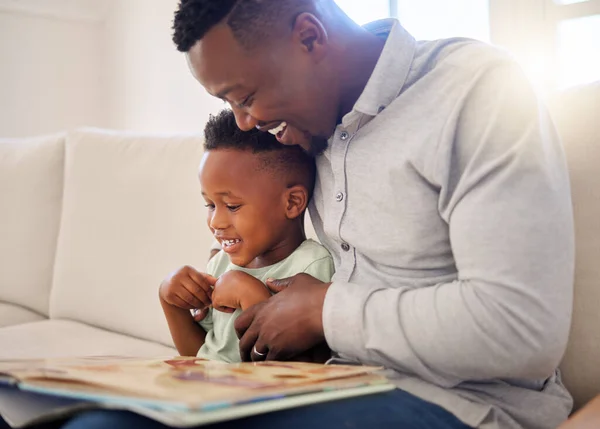 Young Happy African American Father Reading Book His Son Sitting — Stock fotografie