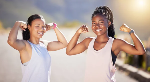 Portrait Two Happy Young Female Athletes Showing Arm Muscles While — 스톡 사진