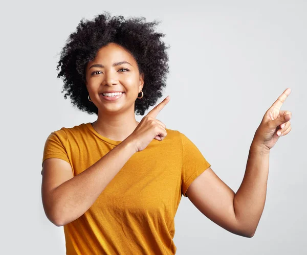 Young Woman Pointing Copy Space Grey Background — Fotografia de Stock