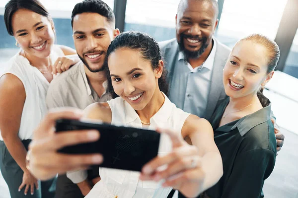 Diverse Group Businesspeople Standing Together Office Taking Selfies Cellphone – stockfoto