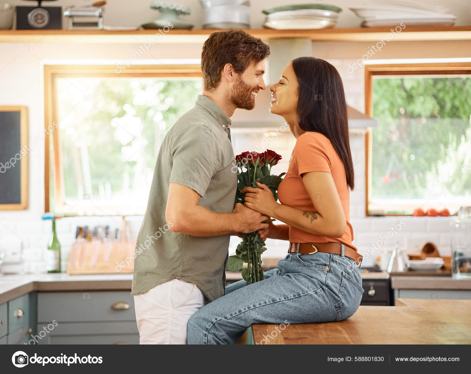 Young Content Caucasian Boyfriend Giving His Cheerful Mixed Race Girlfriend Stock Photo by ©PeopleImages 588801830 picture