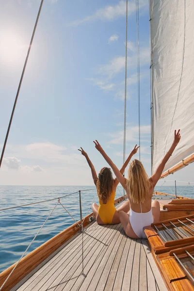 Two Friends Swimsuits Making Peace Signs Celebrating Boat Cruise Two — Foto de Stock