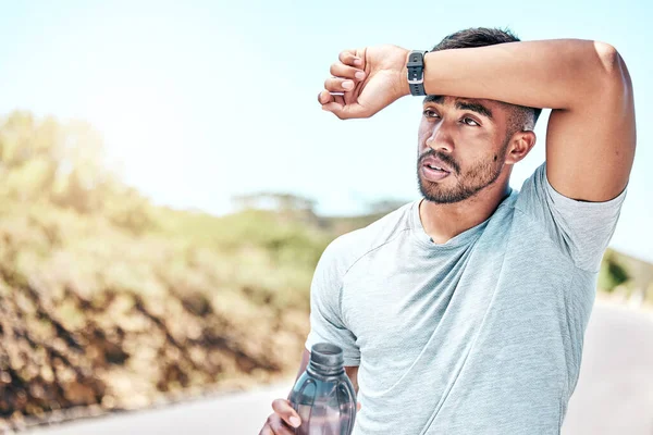 Fit Young Mixed Race Man Looking Tired Drinking Water Bottle — Foto de Stock