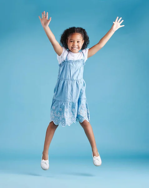 Happy Young Adorable Little Hispanic Girl Jumping Air Isolated Blue — Stok Foto