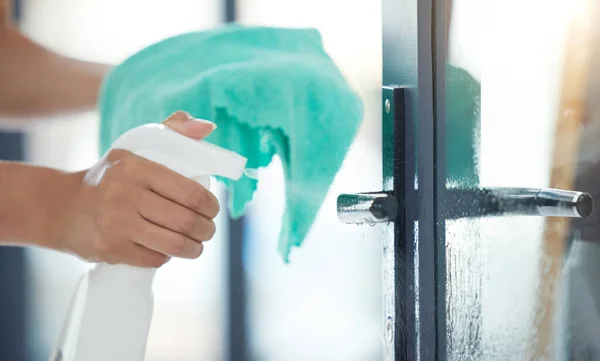 One Unknown Mixed Race Domestic Worker Using Cleaning Product Door — Stockfoto