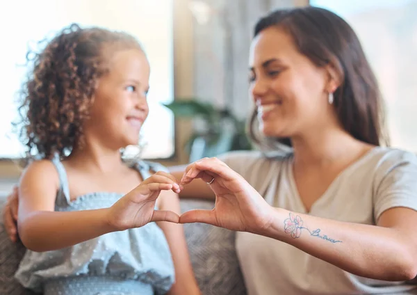 Loving Mother Adorable Daughter Sitting Together Forming Heart Shape Hands — Stockfoto