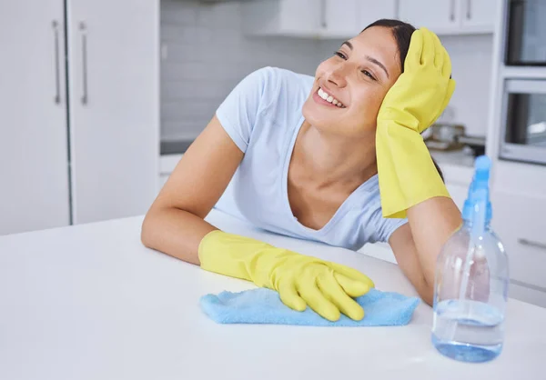 Young Woman Smiling While Cleaning Kitchen Counter — Stockfoto