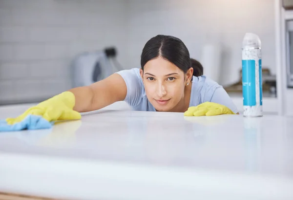 Young Woman Smiling While Cleaning Kitchen Counter — ストック写真