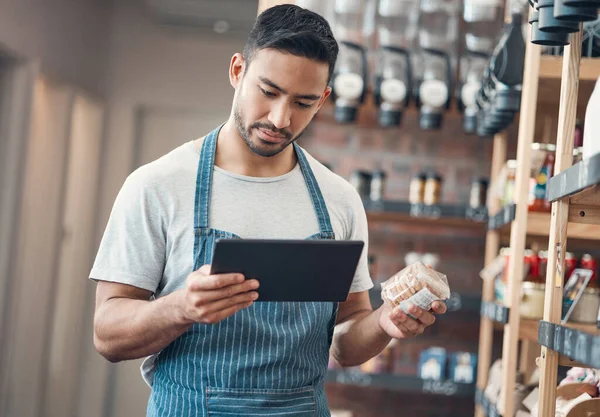 One Young Hispanic Waiter Using Digital Tablet Device While Working — 스톡 사진