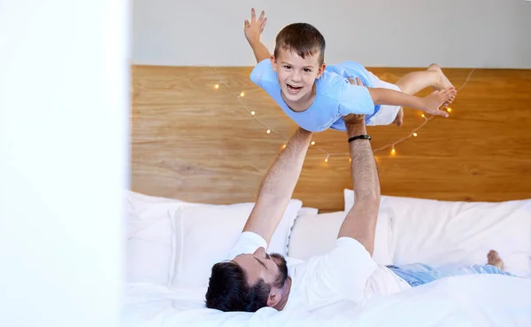 Caucasian Father Lifting His Cute Little Son Air Pretend Fly – stockfoto
