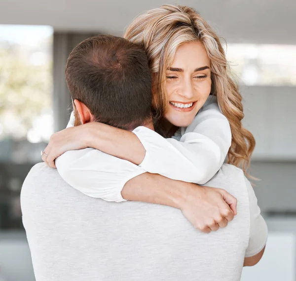 Excited woman hugging her boyfriend. Husband carrying his wife. Happy girlfriend hugging her boyfriend.Romantic couple hugging at home. Caucasian couple affectionately embracing