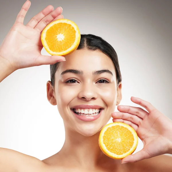 Young Happy Beautiful Woman Holding Orange While Posing Grey Studio — Stok fotoğraf