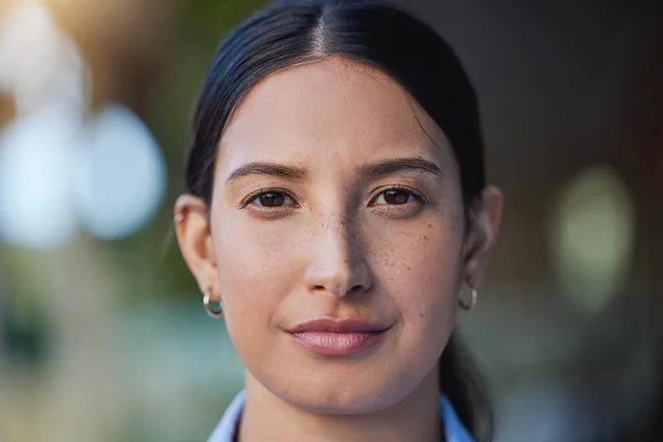 Closeup portrait of mixed race womans face and eyes looking forward and into the camera. Zoom headshot of a hispanic woman staring and watching in front. Healthy eyecare for clear optics and vision.