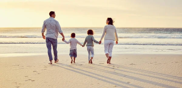 Family Two Children Holding Hands While Walking Beach Sunset Mixed — стоковое фото