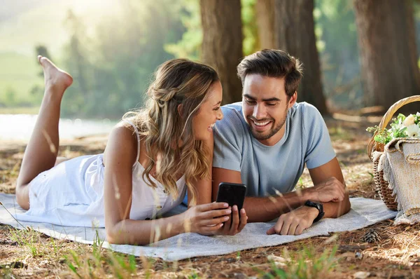 Couple Looking Something Digital Tablet While Having Picnic Forest —  Fotos de Stock