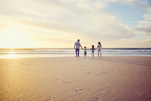 Rear View Shot Carefree Family Holding Hands While Walking Sunset – stockfoto