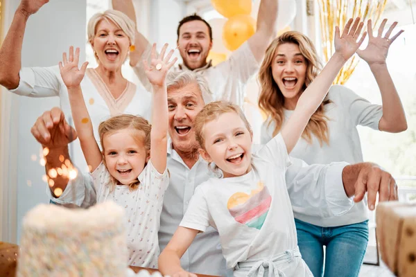 Three cheers for another fun filled year. a happy family celebrating a birthday at home