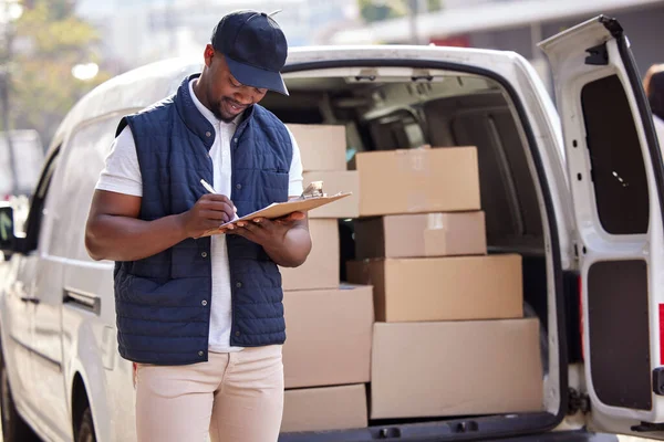 We dont take time for granted. a delivery man standing by his van