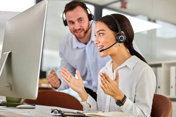 Your help is so appreciated. two coworkers working together in a call center