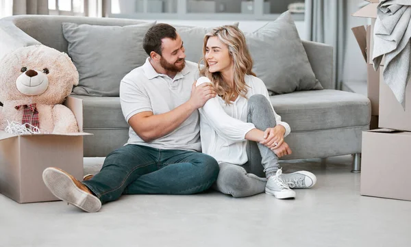 Loving Couple Looking Each Other While Sitting New Home Young — Φωτογραφία Αρχείου